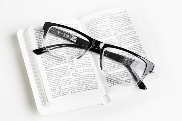 White Pocket Bible With Reading Glasses Stock Picture