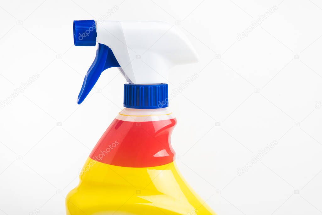 A close-up of the top portion of a red, white, and blue liquid spray plastic dispenser bottle set on a plain white background.