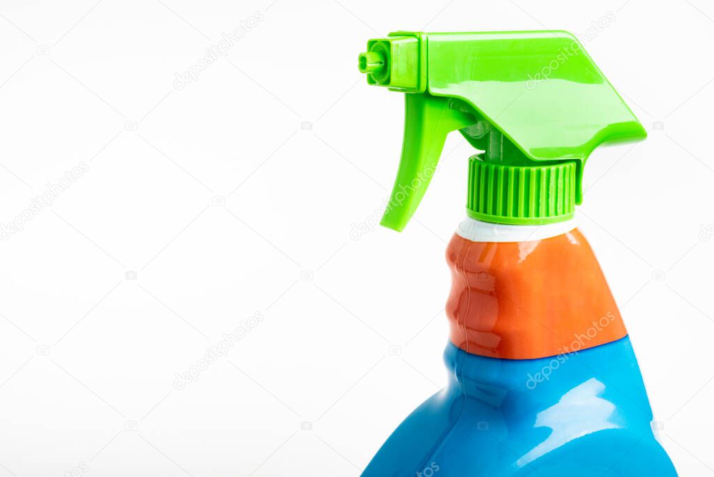 A close-up of the top portion of a colorful liquid spray plastic dispenser bottle set on a plain white background.
