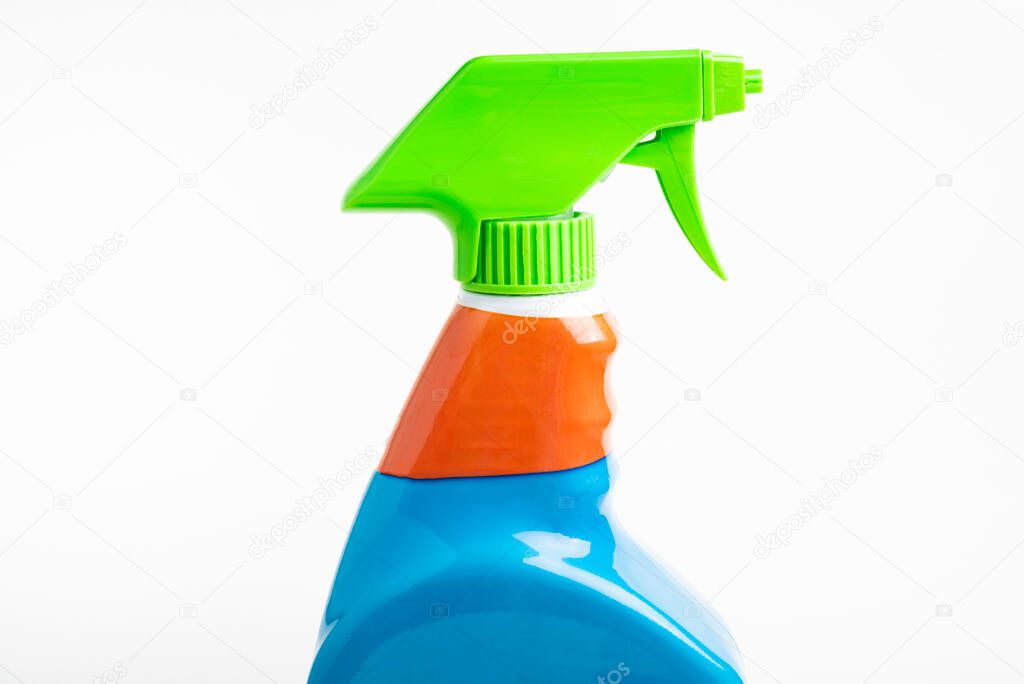 A close-up of the top portion of a colorful liquid spray plastic dispenser bottle set on a plain white background.