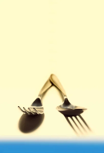 Cutlery on coloured background — Stock Photo, Image