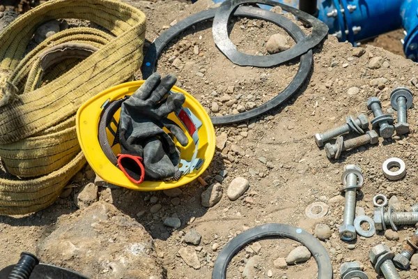 Construction Helmet Gloves Ground Nearby Bolts Nuts Gaskets — Stock Photo, Image