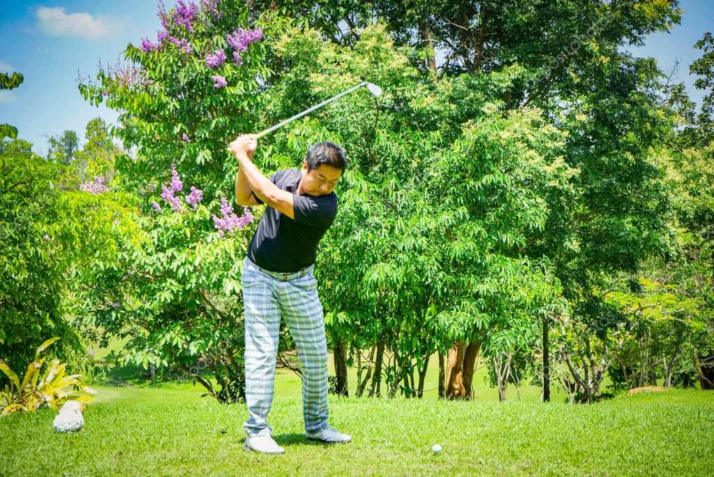 Golfer playing golf in beautiful golf course in the evening golf course with sunshine in thailand