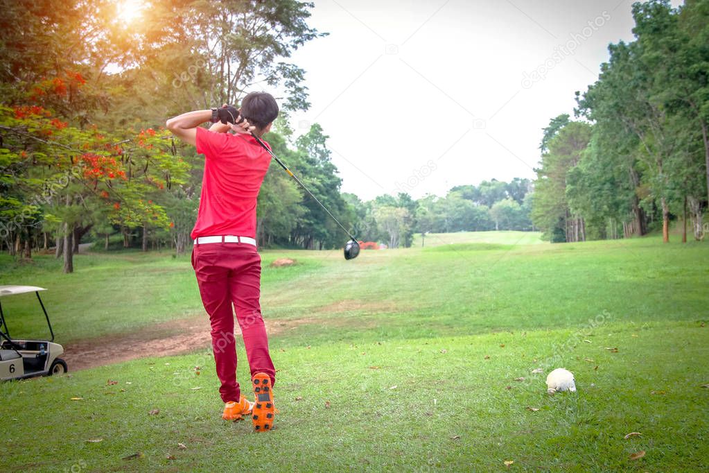 Golfer playing golf in beautiful golf course in the evening golf course with sunshine in thailand