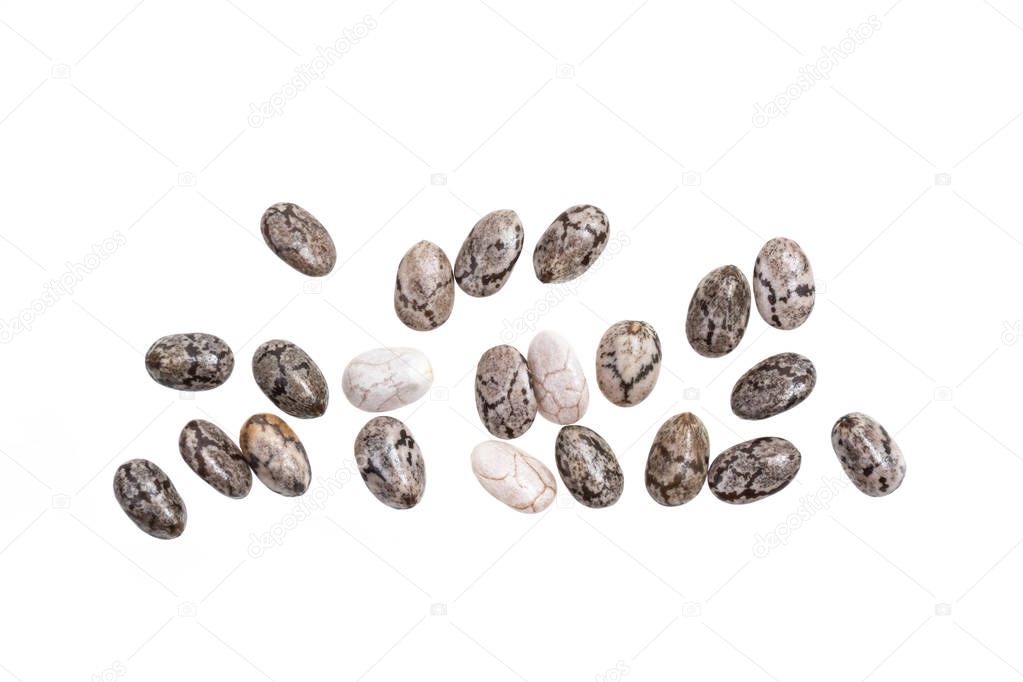 Close up of some healthy chia seeds spread out and isolated on white background