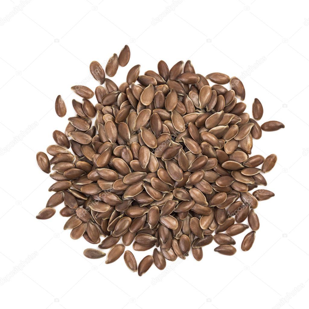 Small pile of linseeds or flax seed seen directly from above and isolated on white background