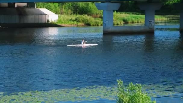 Kayak-paddling. Man in canoe floating down the river — Stock Video