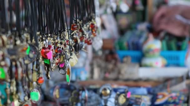 Funny costume jewelry in the gift shop, on the street. — Stock Video