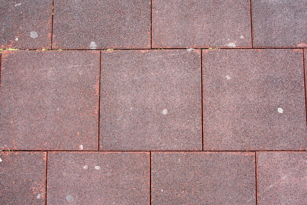 Square tiles rubber crumb flooring.