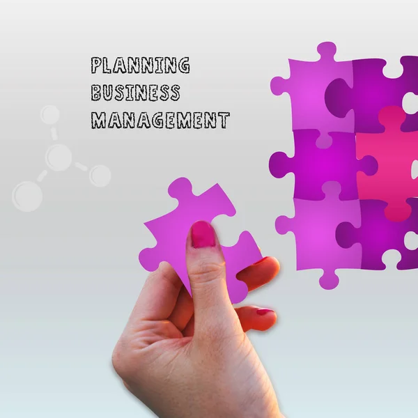 Business solutions women holding Puzzle with planning and business management text in gray background.