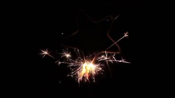 Star Shaped Sparkler Lit One End — Stock Video