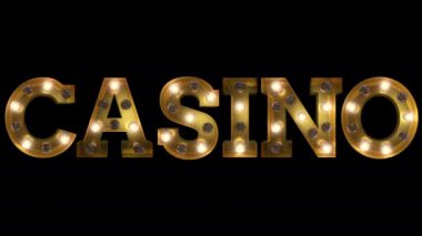 Ampul harfi yanıp sönüyor. Kumarhane kelimesini heceliyor.