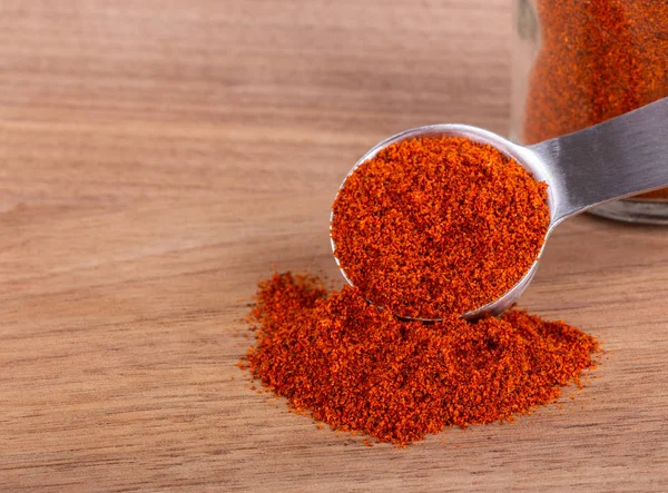 Ground Paprika on a Wooden Table