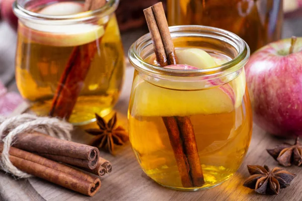 Glass of Cider With Apple Slices and Cinnamon