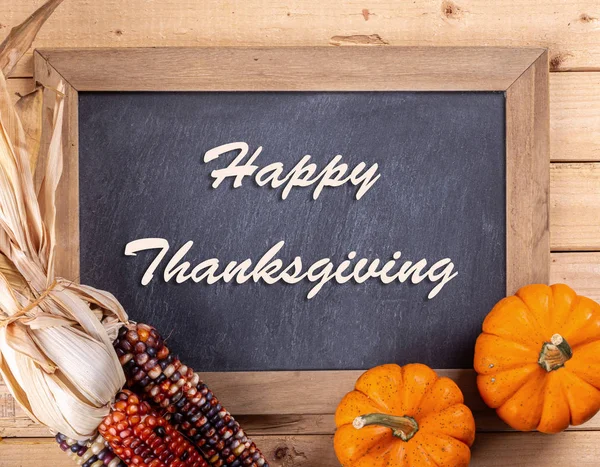 Happy Thanksgiving Text on Chalkboard Bordered With Pumpkins and — Stock Photo, Image