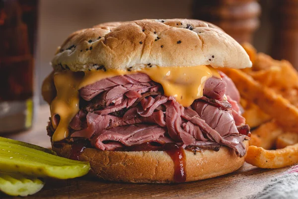Roast Beef Sandwich Cheddar Cheese Barbecue Sauce Onion Roll Rustic — Stock Photo, Image