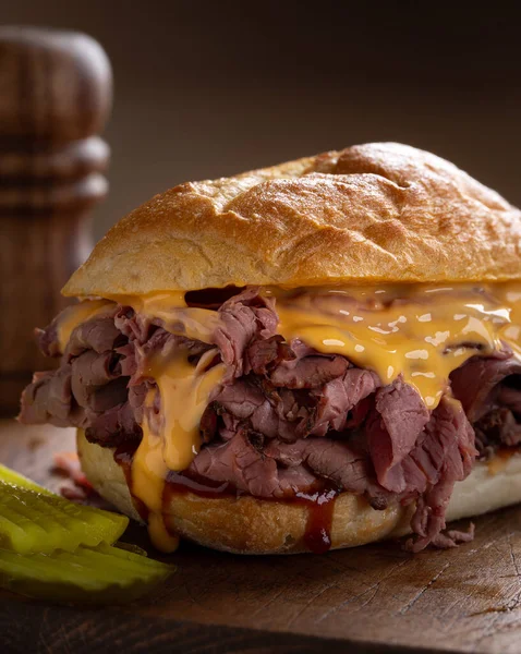 Roast Beef Sandwich Cheddar Cheese Barbecue Sauce Bun Rustic Wooden — Stock Photo, Image