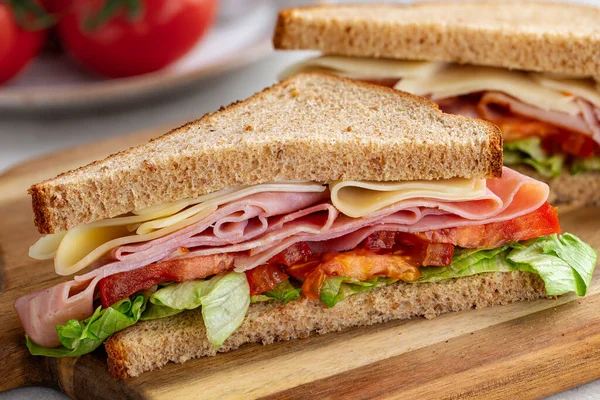 Sandwich Ham Cheese Lettuce Tomato Whole Wheat Bread Cut Half — Stock Photo, Image