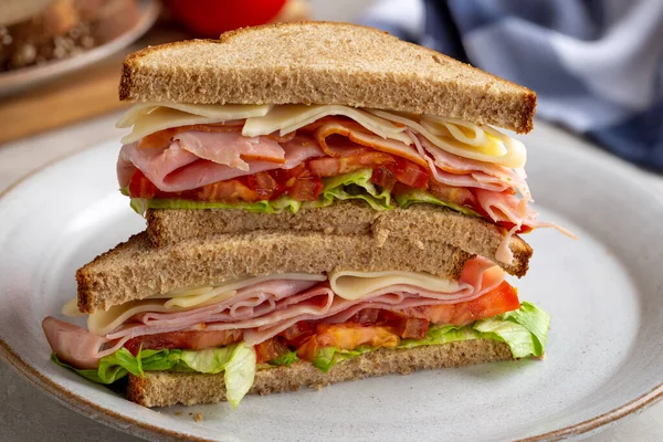 Sandwich Ham Cheese Lettuce Tomato Whole Wheat Bread Cut Half — Stock Photo, Image