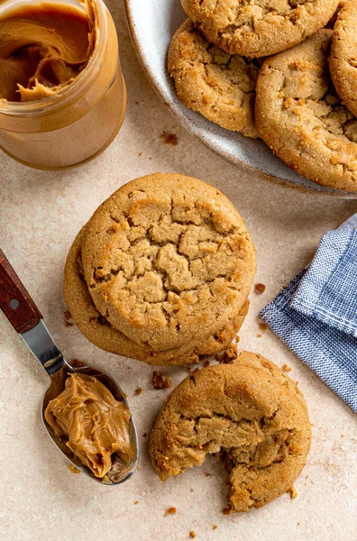 Overhead of peanut butter cookies on a table and plate