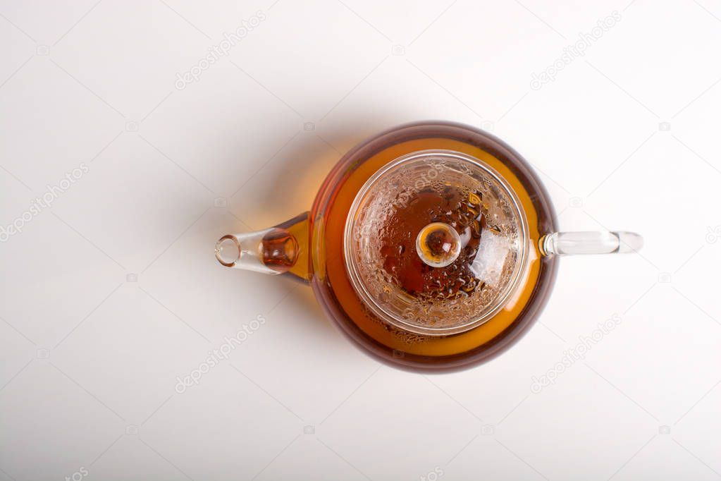 Teapot with black tea.