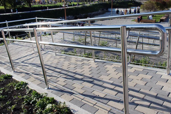 Wheelchair ramp, for strollers with children, an inclined plane installed in addition to or instead of the stairs, a path on the slope for the disabled