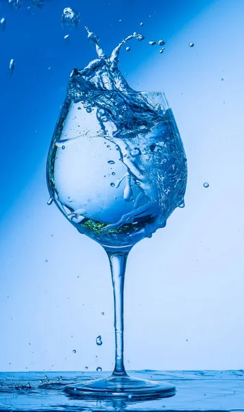 glass, wine, drink, water, alcohol, wineglass, blue, isolated, empty, white, liquid, transparent, clear, beverage, clean, object, crystal, goblet, reflection, drop, bar, single, fresh, cold, celebration