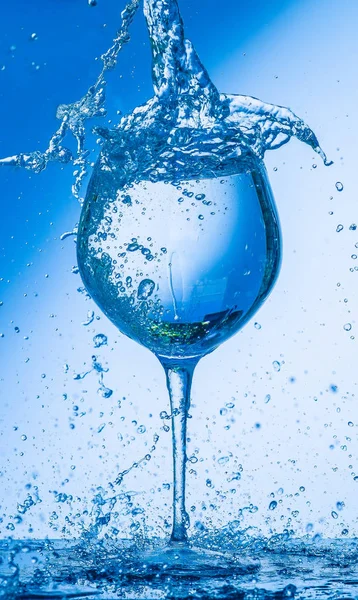 glass, wine, drink, water, alcohol, wineglass, blue, isolated, empty, white, liquid, transparent, clear, beverage, clean, object, crystal, goblet, reflection, drop, bar, single, fresh, cold, celebration