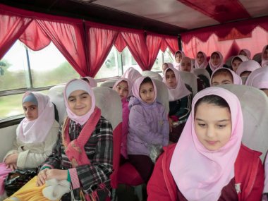 Elementary school services for girls. An Islamic school where girls should wear scarves and dress uniforms. Girl students in school service clipart