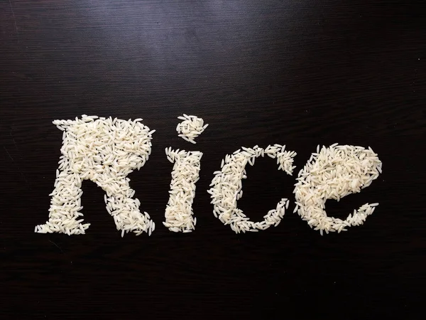 Schreiben Sie Das Wort Reis Mit Reissamen Auf Einen Tisch — Stockfoto