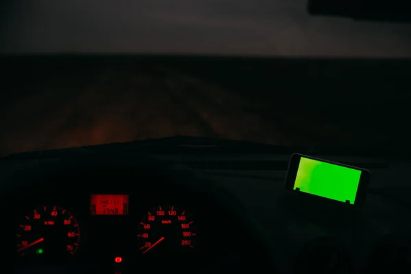 Night road in the car phone with a green background chroma key