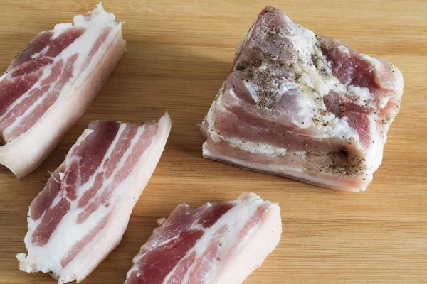 Salted lard with pepper and garlic close-up, sliced fat, — Stock Image Salted lard with pepper and garlic close-up, sliced fat, Stock Photo