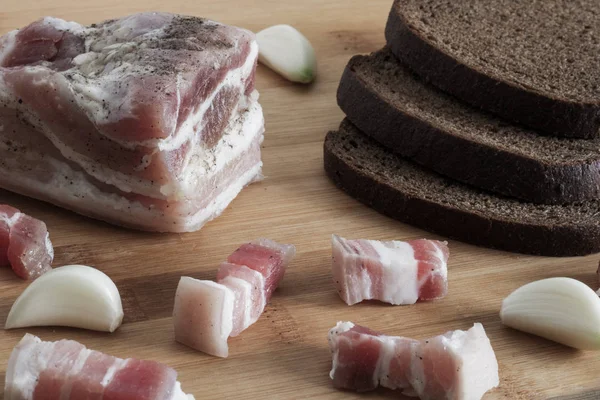 Salted lard with pepper and garlic close-up, sliced fat, — Stock Image Salted lard with pepper and garlic close-up, sliced fat, Stock Picture