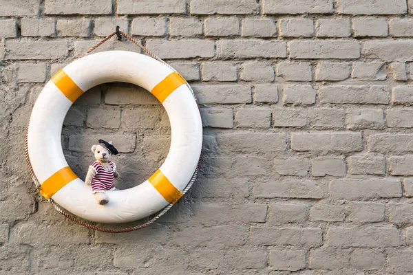 Vintage Life Buoy Brick Wall Background Cute Little Teddy Bear — Stock Photo, Image