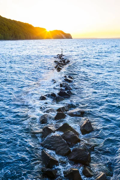 Breakwater Barrier Stones Warning Sign Coast Sunset Sky Hills Sea — Stock Photo, Image