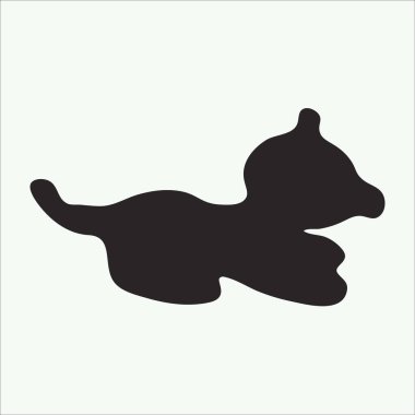 Küçük oyuncak bir köpeğin siyah silueti.