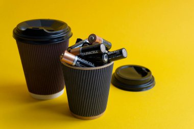 Kiev, Urkaine, 16 June 2020, Duracell AA batteries are in coffee takeaway cup clipart