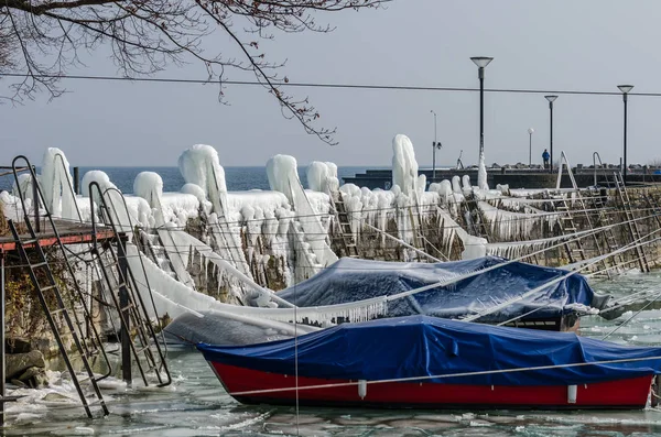 Frozen Boats Covered With Ice