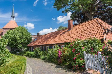 Small Street in the village of Rysum, East Frisia, Lower Saxony, Germany clipart