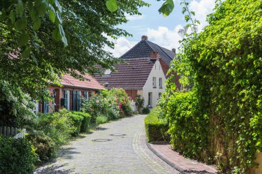 Small Street in Rysum, East Frisia, Lower Saxony, Germany clipart