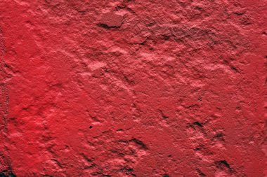 Soyut kırmızı odak arkaplanı, toprak yüzeyi, boyanmış taş duvar dokusu