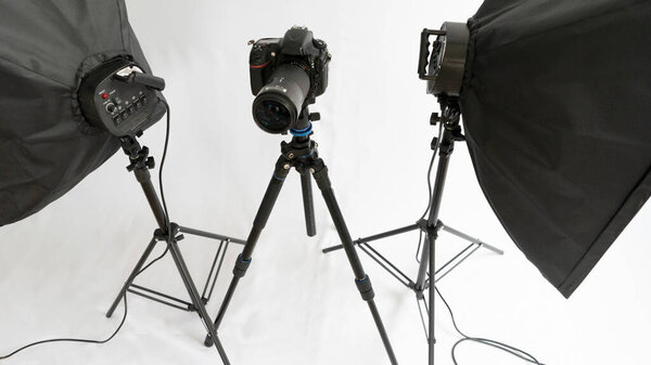 Dslr camera on tripod wirt two soft box. Studio set for shooting