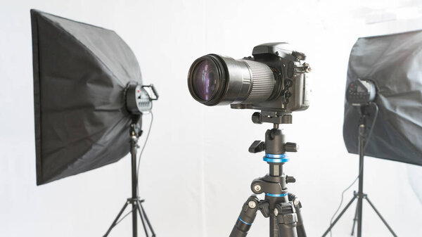 Dslr camera on tripod wirt two soft box. Studio set for shooting