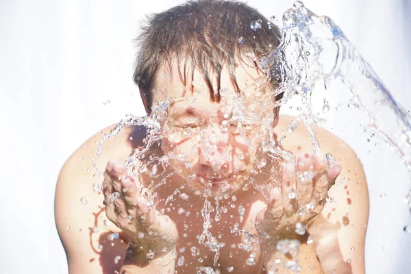 Guy Washes His Face Water Drops Fly Different Directions White Royalty Free Stock Images