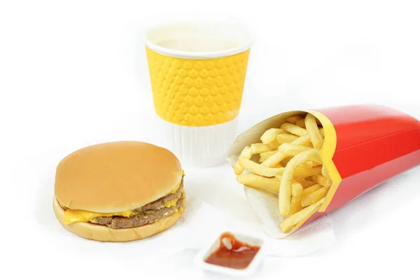 fast food burger and fries with ketchup and cofee on white background