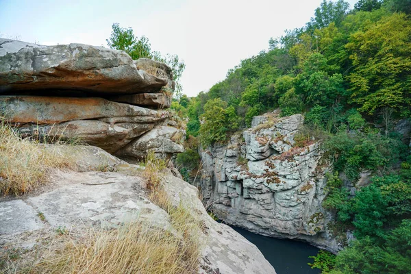 a large sheer cliff above the water