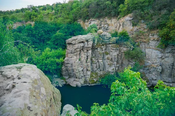 a large sheer cliff above the water