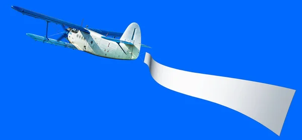 Uçak Ile Beyaz Bir Bayrak Mavi Gökyüzü Karşı — Stok fotoğraf
