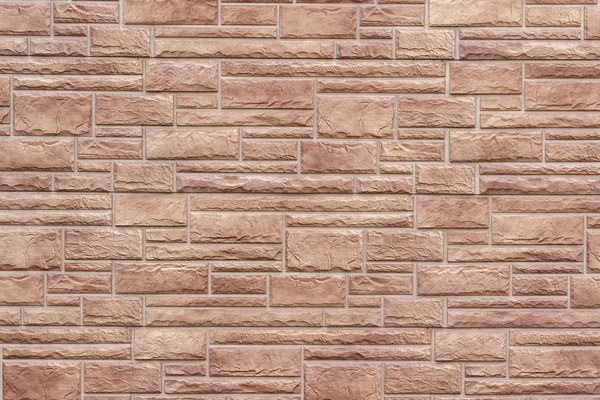 Dekoracyjna ściana z cegły bliska jako tło lub tekstura. — Zdjęcie stockowe