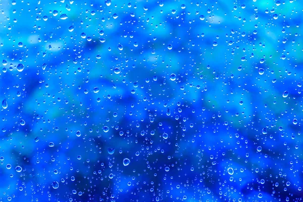 Gotas de água na textura de fundo azul abstrata — Fotografia de Stock